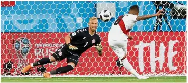  ?? — Reuters ?? Guessing game: Denmark goalkeeper Kasper Schmeichel diving to his left as Peru’s Christian Cueva misses a penalty in the Group C match at the Mordovia Arena in Saransk on Saturday.