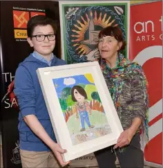  ??  ?? JP McKeown from Dulargy NS with Dolores Whelan at the Brigid of Faughart 2020 Art Competitio­n held in An Táin. Pictures: Ken Finegan/ Newspics