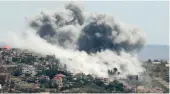  ?? AFP ?? Smoke billows from the site of an Israeli airstrike on the southern Lebanese village of Khiam.