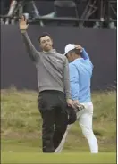  ?? AP photo ?? Rory McIlroy waves to the crowd after completing the second round of the British Open on Friday.