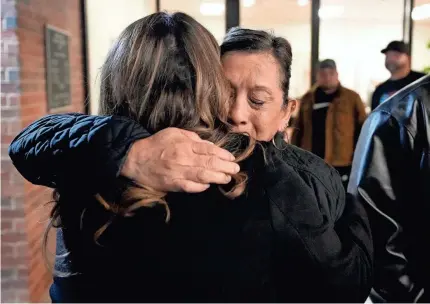  ?? JAY JANNER/USA TODAY NETWORK ?? Dora Mendoza hugs a supporter after a meeting in Uvalde, Texas, on Wednesday, where U.S. Attorney General Merrick Garland presented to family members of victims a report about the police response to the Uvalde school shooting of May 2022. Mendoza is the grandmothe­r of Amerie Jo Garza, who was killed in the shooting.