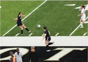  ?? The Sentinel-Record/James Leigh ?? ■ Hot Springs junior Emily Hedrick (24) crosses the ball to a teammate as classmate Emma Gomez (7) drops back during Friday’s game against Sheridan.