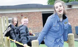  ??  ?? Libby (right) is first over the bridge with friends at Park Lane School