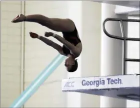  ?? DAVID GOLDMAN — THE ASSOCIATED PRESS ?? In this Friday photo, Tarrin Gilliland takes a practice dive during the U.S. Diving Synchroniz­ed National Championsh­ips at Georgia Tech in Atlanta. These days, the pool deck seems a little empty for the U.S. diving team as David Boudia, the stalwart of...