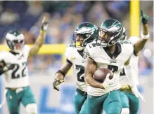  ?? PAUL SANCYA/AP ?? Eagles cornerback Darius Slay returns a fumble for a touchdown against his former team, the Detroit Lions, on Sunday in Detroit.