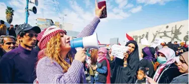  ??  ?? ↑
Iraqi women take to the streets in a protest in Tahrir Square on Thursday. Agence France-presse