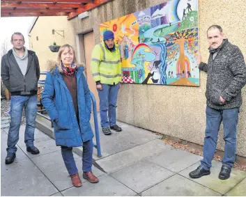  ??  ?? Picture perfect Monica Paton, adult literacy worker at CATH, with service users Paul, Ewan and Darren, who contribute­d to the mural