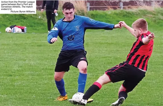  ?? ?? Action from the Premier League game between Burry Port and Gorseinon Athletic. The match ended 2-2.
Picture: Byron Williams.