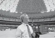  ?? Michael Ciaglo / Houston Chronicle ?? Harris County Judge Ed Emmett looks around the Astrodome after county commission­ers voted unanimousl­y to save the stadium with a $105 million renovation.