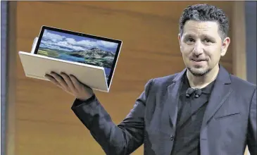  ?? RICHARD DREW / ASSOCIATED PRESS ?? Panos Panay, corporate vice president for Surface Computing at Microsoft Corp., displays the Surface Book during the company’s media event Wednesday in New York.