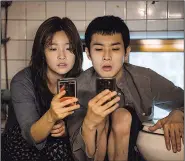 ??  ?? Siblings Kim Ki-jung (So-dam Park) and Kim Ki-woo (Woo-sik Choi) are poor kids looking for a way to get over in Joon-Ho Bong’s Parasite, a film that has received near-universal praise since its debut at the Cannes Film Festival.