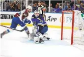  ?? JEFF ROBERSON AP ?? Colorado’s Logan O’connor (25) scores past Blues goaltender Ville Husso during the first period.