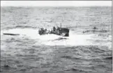  ?? ASSOCIATED PRESS FILE PHOTO ?? The crew of German submarine U-550 abandoning ship in the Atlantic Ocean after being depth charged by the USS Joyce, a destroyer.