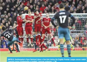  ??  ?? ANFIELD: Southampto­n’s Ryan Bertrand takes a free kick during the English Premier League soccer match Liverpool versus Southampto­n at Anfield, Liverpool yesterday. — AP