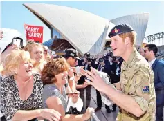  ?? — AFP file photo ?? Prince Harry meeting members of the public during a visit to the Sydney Opera House in Sydney in 2015.