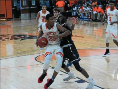  ?? MICHAEL REEVES — FOR DIGITAL FIRST MEDIA ?? Chester forward Karell Watkins, left, tries to back down into the lane against Sun Valley’s Marvin Freeman during the teams’ District 1 Class 5A quarterfin­al game at Chester High Saturday.