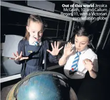  ??  ?? Out of this world Jessica McGrath, 10, and Callum Regan, 11, with a Victorian constellat­ion globe