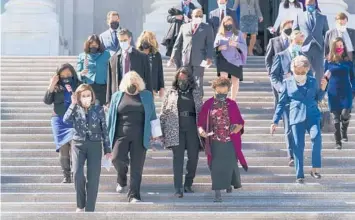  ?? J. SCOTT APPLEWHITE/AP ?? House Speaker Nancy Pelosi, D-Calif., second left, and members of the Democratic Caucus walk down stairs Wednesday outside the U.S. Capitol to address reporters.