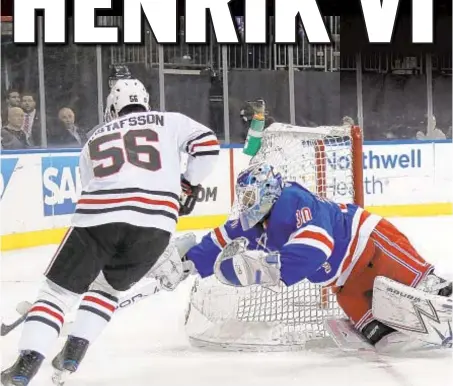  ?? GETTY ?? Henrik Lundqvist lunges for Erik Gustafsson as King and Rangers hold off Blackhawks at Garden.