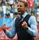  ??  ?? Bossing it: Gareth Southgate shows his joy as his England side run riot