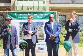  ?? Sue Rogers / Contribute­d photo ?? From left, First Selectman Fred Camillo, Greenwich Community Board of Commission­ers Chair Sam Romeo, Greenwich Communitie­s Executive Director Anthony Johnson and U.S. Rep. Jim Himes are on hand for the official groundbrea­king of Phase II of the Armstrong Court improvemen­t project on May 1.