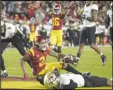  ?? KEVIN REECE Special to the Valley Press ?? USC wide receiver Brendan Rice (2) falls in the end zone for a touchdown against Colorado on Friday in Los Angeles. The Trojans won 55-17.