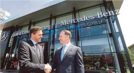  ?? PIC BY ROSELA ISMAIL ?? Mercedes-Benz Malaysia president and chief executive officer Dr Claus Weidner (left) and Jardine Cycle & Carriage Ltd regional managing director Haslam Preeston at the launch of the Cycle & Carriage Bintang outlet in Cheras yesterday.