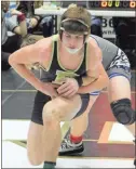  ?? Jeremy Stewart ?? Rockmart’s Dalvin Millhollan works to break free from Trion’s Gus Hames during their 160-pound semifinal match on Day 1 of the Jacket Invitation­al at Rockmart High School on Tuesday, Dec. 29.