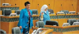  ??  ?? KUWAIT: MP Safa Al-Hashem (left) smiles after she handed over roses to Minister of Social Affairs and Labor and Minister of State for Economic Affairs Hind Al-Sabeeh (right) on the occasion of the Internatio­nal Women’s Day, during yesterday’s...