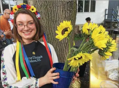  ?? PAUL POST — PPOST@DIGITALFIR­STMEDIA.COM ?? Anastasia O’Neill of Albany wore traditiona­l Ukrainian dress including a flower crown at Saturday’s festival.