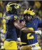  ?? GETTY IMAGES ?? Michigan’s Donovan Peoples-Jones (left) and Shea Patterson celebrate a TD Saturday.