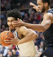  ?? LAURENCE KESTERSON — THE ASSOCIATED PRESS ?? Villanova forward Jermaine Samuels, left, moves around Butler forward Bryce Nze during the first half Tuesday night.