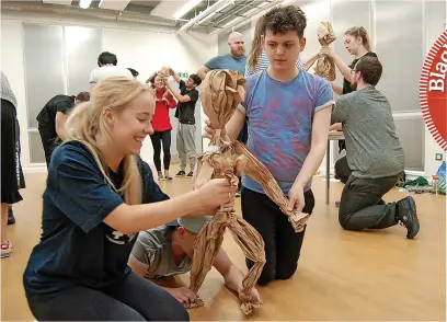  ?? ?? Left: System of Strings take their puppetry skills out into the community
