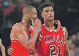  ??  ?? Jimmy Butler ( right) disputed a report that he had a beef with Dwyane Wade ( left) last season. ‘‘ For that report to be floating out there is crazy,’’ he said.
| GETTY IMAGES