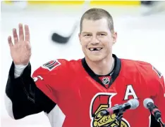  ?? THE CANADIAN PRESS FILES ?? Chris Neil salutes the crowd last December during a ceremony to mark his 1,000th NHL game. Neil announced his retirement on Thursday.