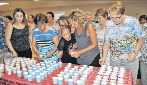  ??  ?? People line up to get a sample of the fare served at the second annual Chopped Argyle at the West Pubnico Legion on Aug. 14.