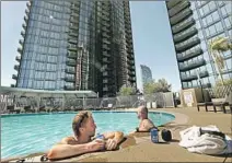  ?? Genaro Molina Los Angeles Times ?? RESIDENTS of the $500-million Circa complex, which towers above Figueroa Street, can relax in one of its two pools.