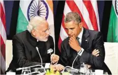  ?? PTI ?? Warm rapport Prime Minister Narendra Modi and US President Barack Obama at the UN Climate Change Conference in Paris, France, on Monday.