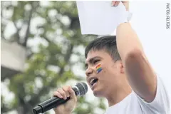  ??  ?? Student leader Tattep Ruangprapa­ikitseree speaks during a pro-democracy rally in Bangkok on Sept 22.