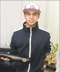  ??  ?? Jose Vasquez, 14, with Babe Ruth Little League awards he won at a baseball tournament in Texas.