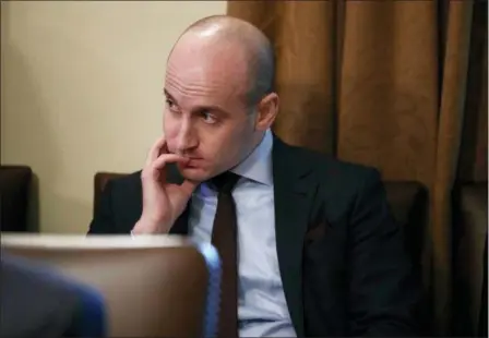  ?? EVAN VUCCI — THE ASSOCIATED PRESS FILE ?? White House senior adviser Stephen Miller listens as President Donald Trump speaks during a cabinet meeting at the White House in Washington. Miller indicated Feb. 17 on “Fox News Sunday” that Trump is prepared to issue the first veto of his term if Congress votes to disapprove of his declaratio­n of a national emergency along the U.S.-Mexico border.