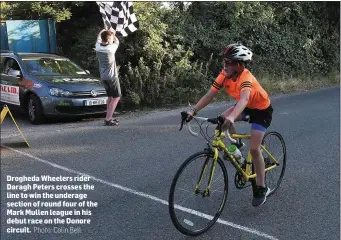  ??  ?? Drogheda Wheelers rider Daragh Peters crosses the line to win the underage section of round four of the Mark Mullen league in his debut race on the Donore circuit.