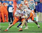 ?? [AP PHOTO] ?? Clemson’s Trevor Lawrence scrambles against Pittsburgh during the second half of the Atlantic Coast Conference championsh­ip on Saturday in Charlotte, N.C.