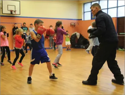  ??  ?? Stephen Reynolds coaching young boxers at training.