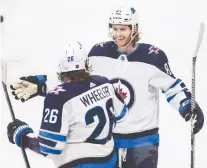  ?? HARRISON BARDEN/USA TODAY SPORTS ?? Winnipeg Jets forward Kyle Connor, right, has goals in five straight games and has 36 on the season.