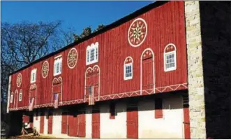  ??  ?? The farmer does not wish me to divulge the exact location for privacy and trespassin­g reasons, therefore the picture is of a common bank barn of the region without this rare feature but does incorporat­e smartly designed balanced hex signs on its forebay.