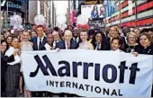  ?? MARRIOTT INTERNATIO­NAL ?? Bill Marriott, chairman of Marriott, and company chief Arne Sorenson celebrate with their executive team and associates Friday in New York’s Times Square.