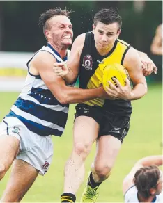  ?? Picture: BRENDAN RADKE ?? CROC ON ROLL: Port Douglas Croc Brett Meredith tackles Hermit Park's Jason Di Betta in the NQ Challenge Cup.