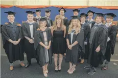  ??  ?? Karen Marshall, Accenture Apprentice Education and Engagement Lead, centre, is pictured with the first Degree Apprentice­ship graduates