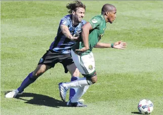  ?? JOHN MAHONEY ?? “I think they want to show they’re better than us,” the Montreal Impact’s Marco Donadel, left, battling a Portland Timbers player last month, says of the New York Red Bulls.